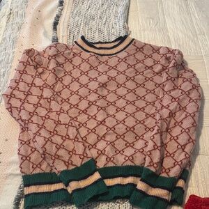 Patterned Pink Sweater with Green Accents